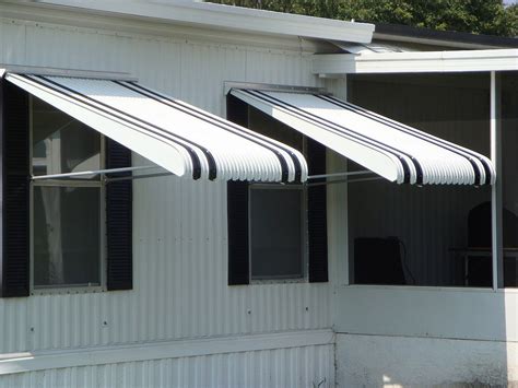 which awning is better fabric or metal|aluminum awnings vs fabric.